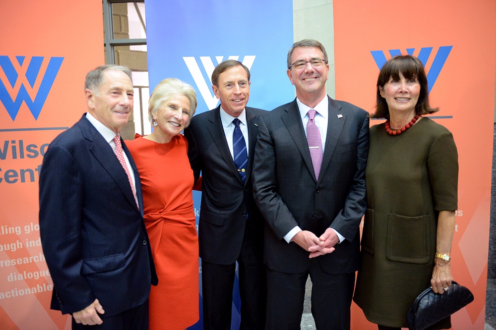 Secretary of defense takes photos with guests before receiving the Woodrow Wilson Award for Public Service