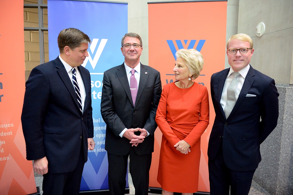 Secretary of defense takes photos with guests before receiving the Woodrow Wilson Award for Public Service