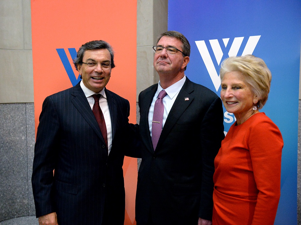 Secretary of defense takes photos with guests before receiving the Woodrow Wilson Award for Public Service