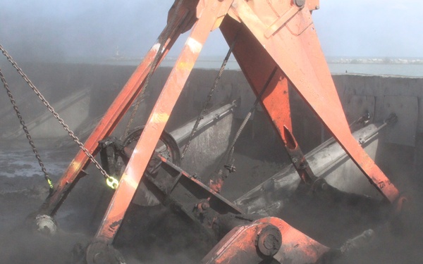 Can activated carbon be used to treat dredged sediments?