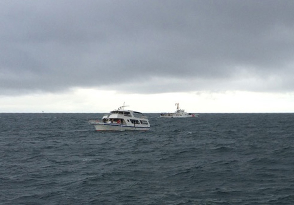 Coast Guard rescues 3 people from sinking vessel