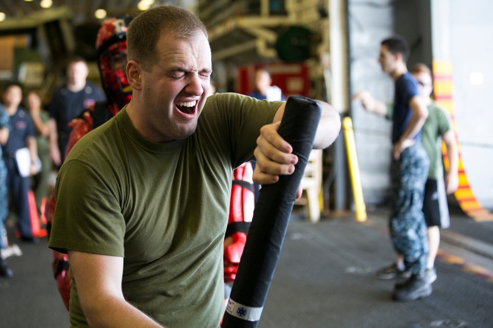 Feeling the Burn: U.S. Marines, Sailors learn non-lethal weapons techniques