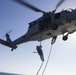 US Marines practice rappelling at sea
