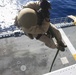 US Marines practice rappelling at sea