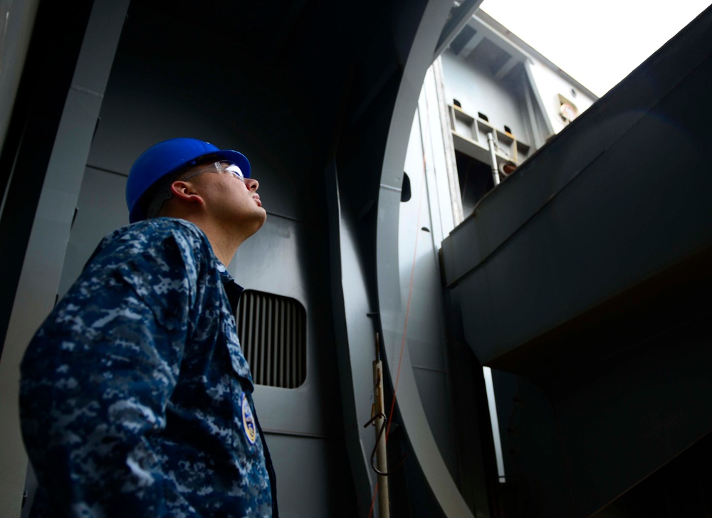 Aircraft elevator maintenance aboard Pre-commissioning Unit Gerald R. Ford (CVN 78)
