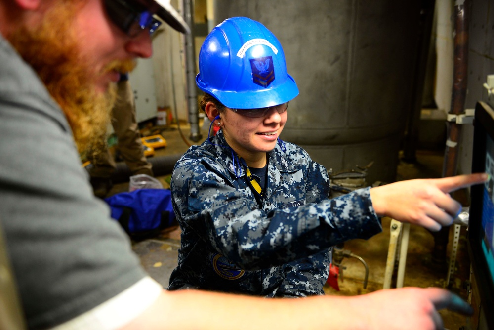 Aircraft elevator maintenance aboard Pre Commissioning Unit Gerald R. Ford (CVN 78)