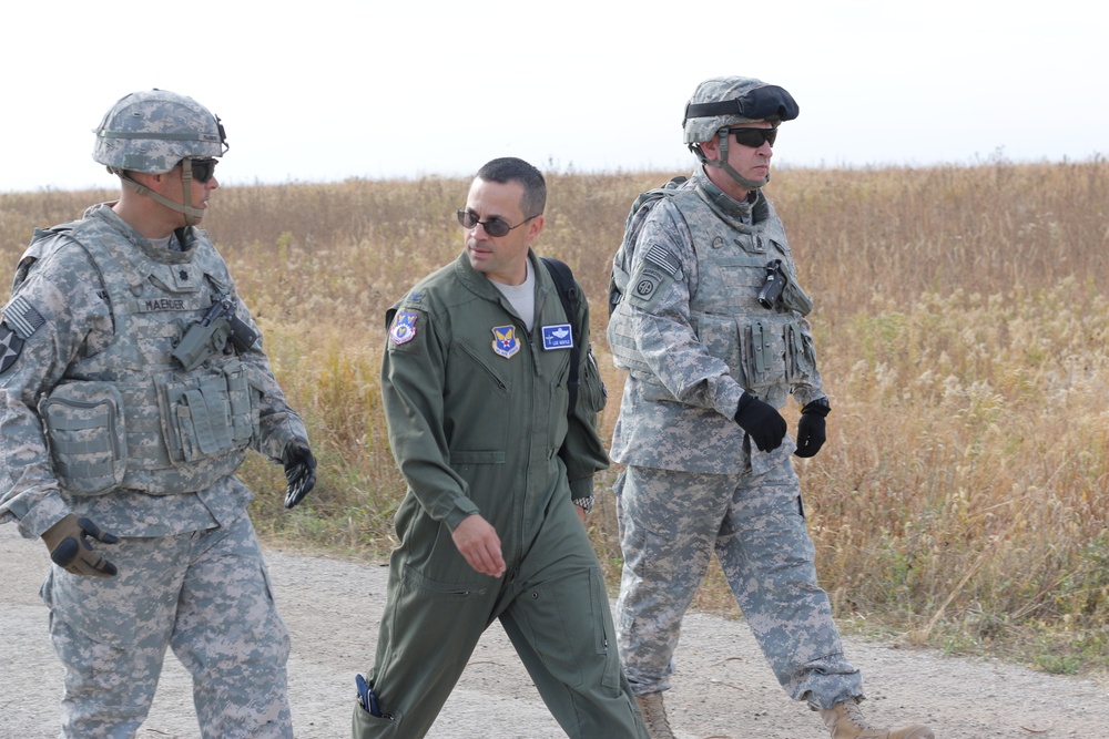 Air Force officers observe artillery capabilities at Fort Riley