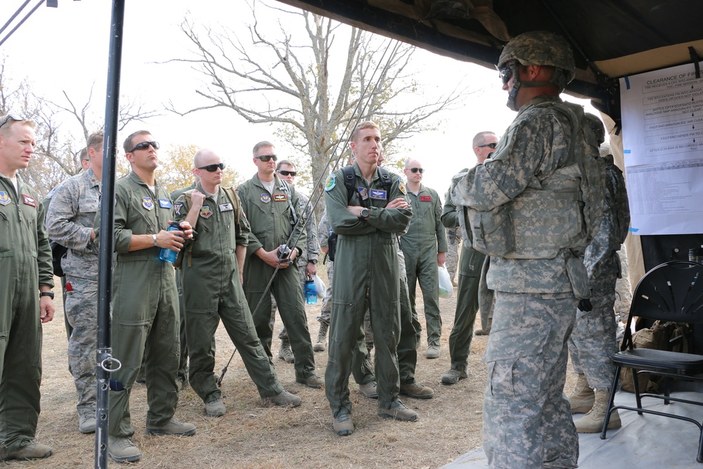 Air Force officers observe artillery capabilities at Fort Riley