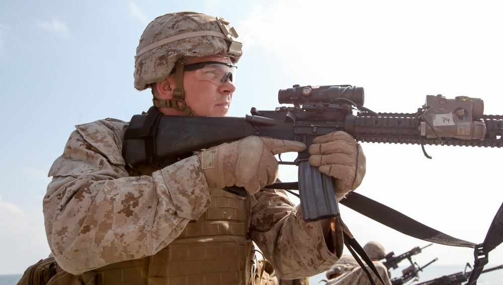 US Marines practice marksmanship at sea