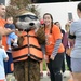 Family poses with Sammy the Sea Otter