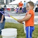 Coast Guard child plays with bubbles at Coast Guard Day 5k