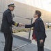 USS New York CO Kenneth Coleman is greeted portside by Dr. Loree Sutton after their arrival in New York.