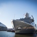 USS New York (LPD 21) arrives on Manhattan's west side as the ship pulls in for port visit