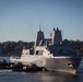 USS New York (LPD 21) arrives on Manhattan's west side as the ship pulls in for port visit