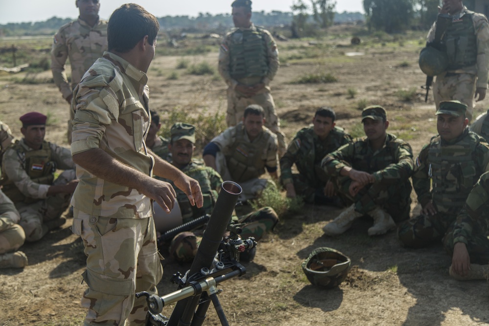 Iraqi soldiers take part in mortar, urban operations training at Camp Taji, Iraq