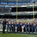 Future service members recite the oath of enlistment in front of fans at MetLife Stadium