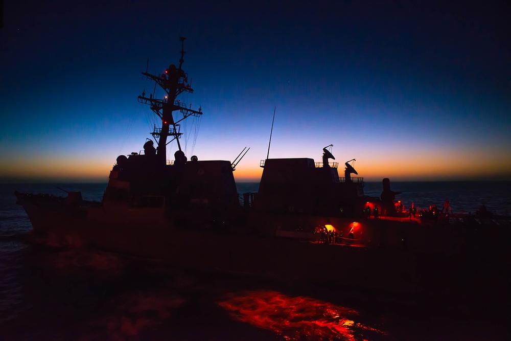 USS Chaffee maneuvers alongside USS George Washington