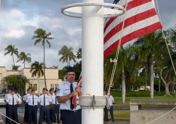 154th Com Flight performs reveille ceremony