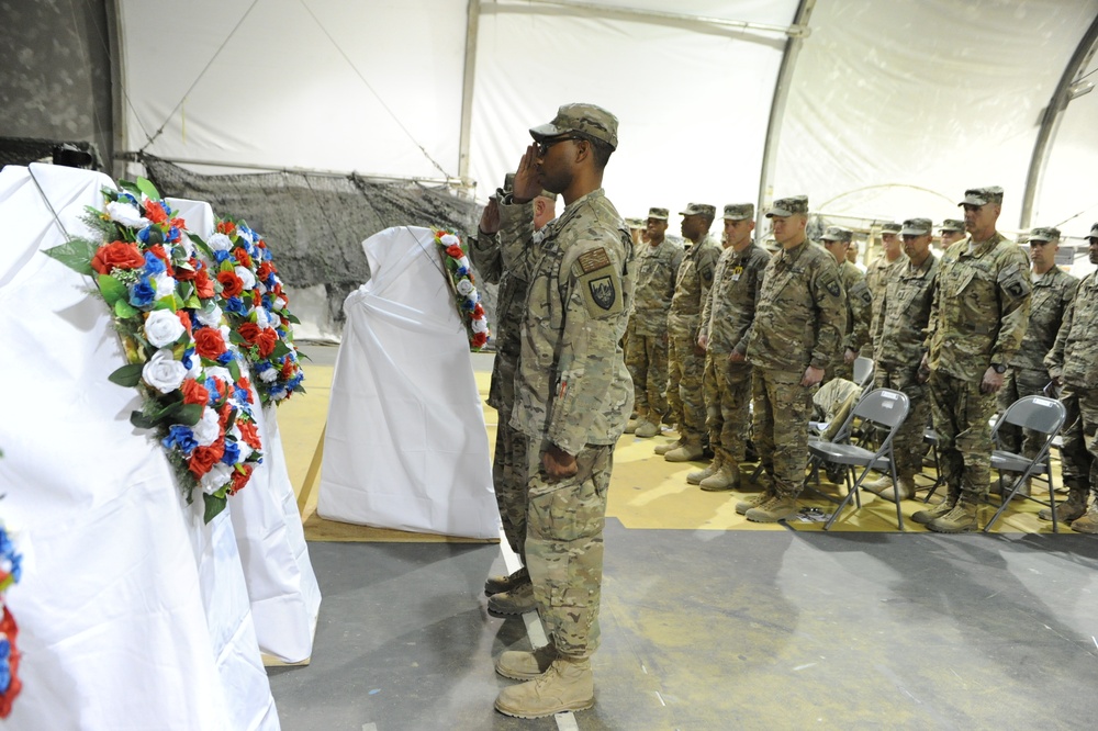 Current Soldiers take a moment to honor those who came before