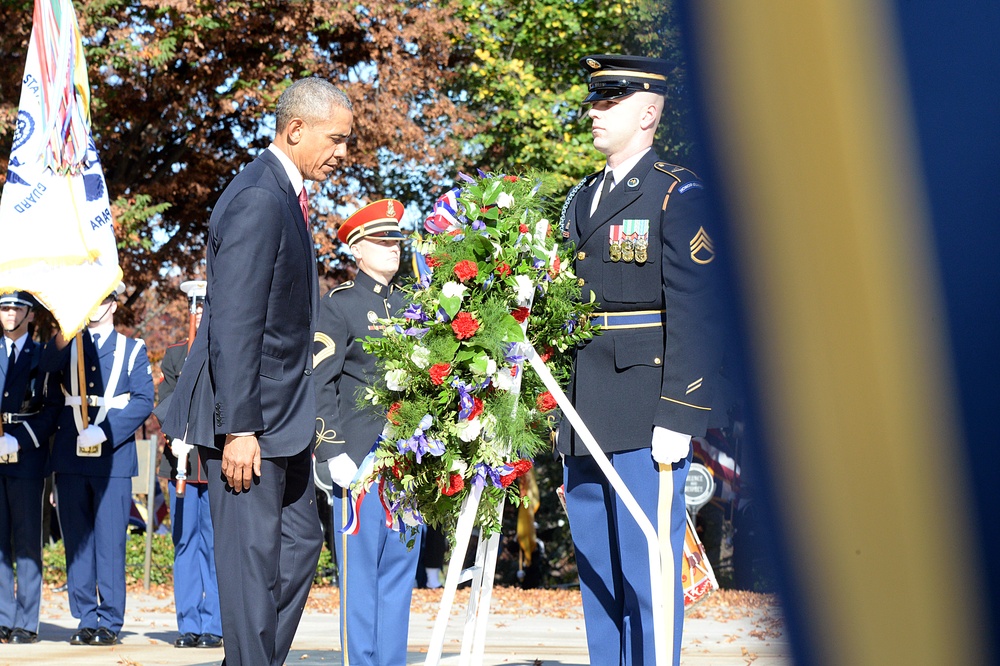 President Obama steps back from laying a wreath at 62nd annual national Veterans Day observance at Arlington National Cemetery