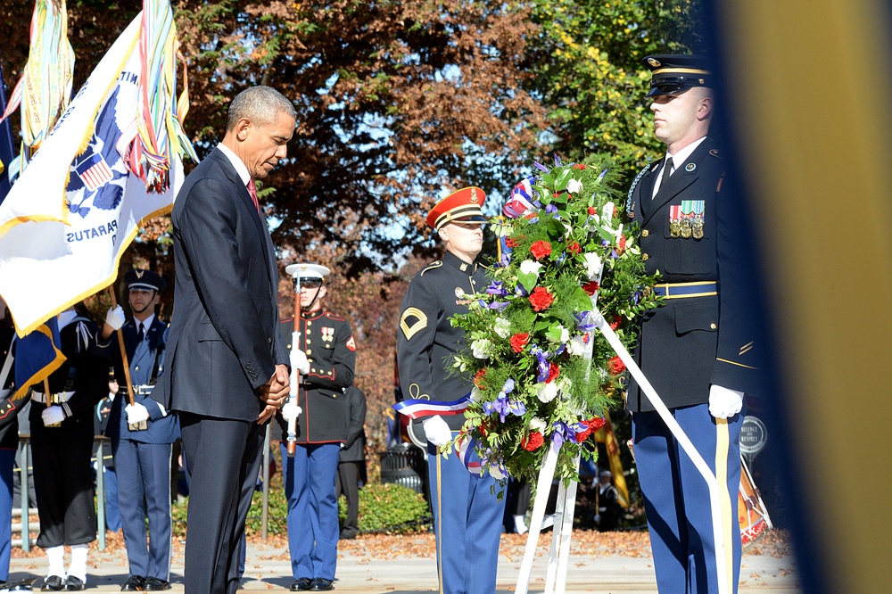 President Obama bows at the 62nd annual national Veterans Day observance at Arlington National Cemetery