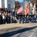 Secretary of defense renders honor during the passing of the colors at the 62nd annual national Veterans Day observance at Arlington National Cemetery