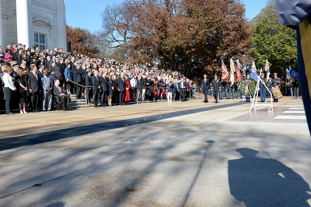 Secretary of defense looks on as President Barack Obama enters at the 62nd annual national Veterans Day observance at Arlington National Cemetery