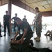 Coastal Riverine Group ONE Detachment Guam Sailors demonstrate mechanical advantage control hold takedown and handcuffing techniques to Royal Cambodia sailors and military police