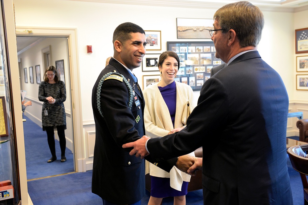 Secretary of defense greets retired Army Capt. Florent Groberg berfore the Medal of Honor Hall of Heroes induction ceremony