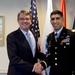 Secretary of defense takes a photo with retired Army Capt. Florent Groberg in his office before the Medal of Honor Hall of Heroes induction ceremony