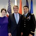 Secretary of defense takes a photo with retired Army Capt. Florent Groberg and his wife before the Medal of Honor Hall of Heroes induction ceremony