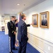 Secretary of defense speaks with retired Army Capt. Florent Groberg and his wife in his office before the Medal of Honor Hall of Heroes induction ceremony