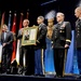 SD, SAC, COS and SMA look on as retired Army Capt. Florent Groberg accepts a plaque during the Medal of Honor Hall of Heroes induction ceremony