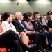 Retired Army Capt. Florent Groberg listens to the secretary of defense speak during his Medal of Honor Hall of Heroes induction ceremony