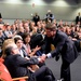 Secretary of Defense shakes hands with retired Army Capt. Florent Groberg's family members at the Medal of Honor Hall of Heroes induction ceremony