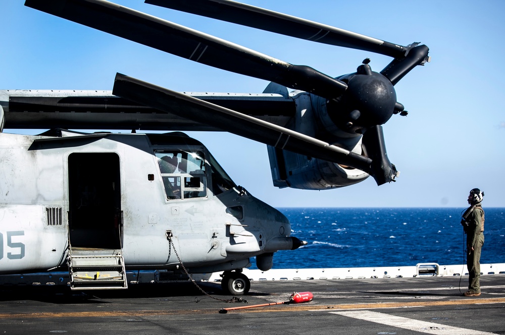 Load ‘em up: U.S. Marines prepare for flight at sea