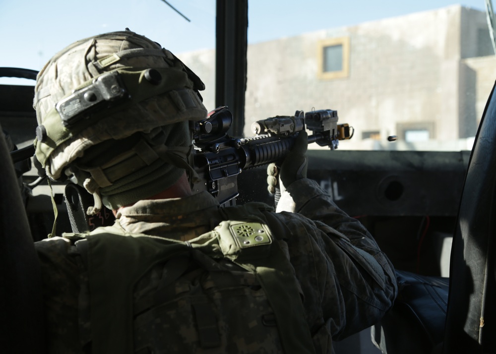 4th Infantry Division Soldier suppresses enemy