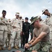 Coastal Riverine Group ONE Detachment Guam Sailors demonstrate vehicle/personnel search and medical application techniques to Royal Cambodia sailors and military police