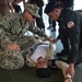 Coastal Riverine Group ONE Detachment Guam Sailors demonstrate vehicle/personnel search and medical application techniques to Royal Cambodia sailors and military police