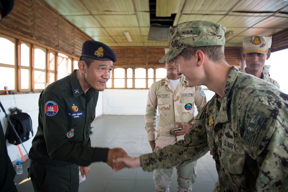 Coastal Riverine Group ONE Detachment Guam (CRG-1 Det Guam) Sailor thanks Royal military police after the completion of a subject matter exchange during CARAT Cambodia 2015