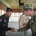 Coastal Riverine Group ONE Detachment Guam (CRG-1 Det Guam) Sailor thanks Royal military police after the completion of a subject matter exchange during CARAT Cambodia 2015