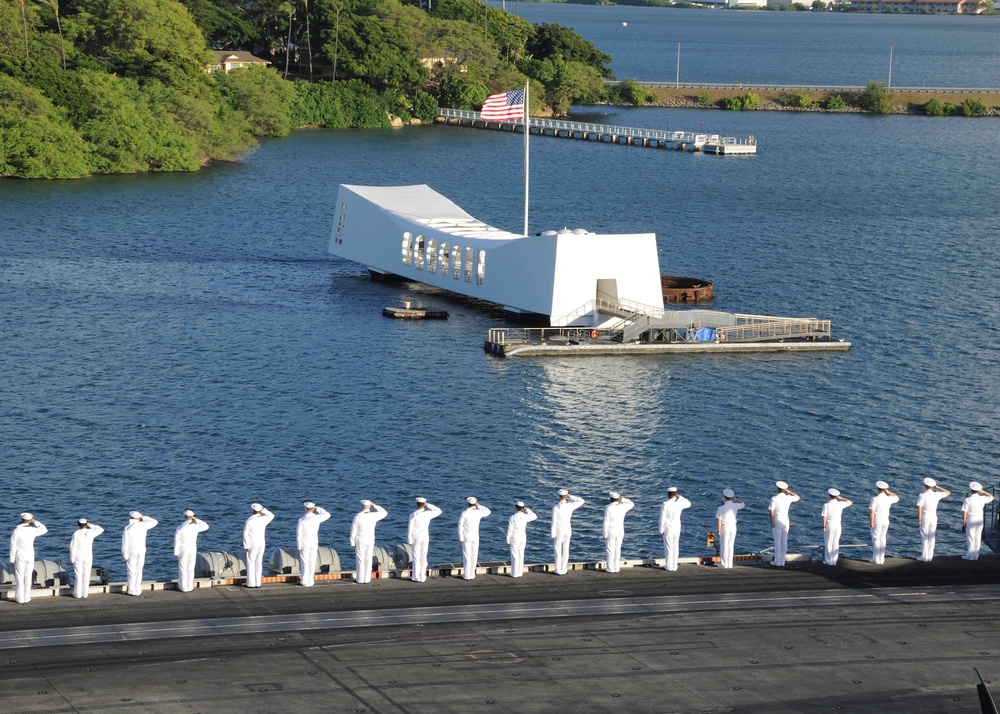 USS Theodore Roosevelt render honors
