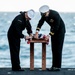 USS Harry S. Truman Sailors participate in burial at sea ceremony