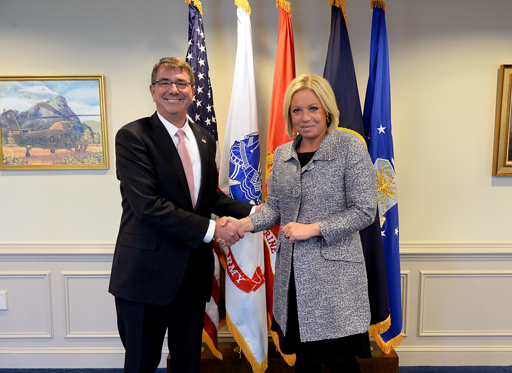 Secretary of defense poses with Netherland's MoD Jeanine Hennis-Plaaschaert