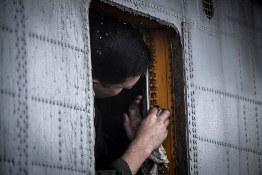 Bird Bath: U.S. Marines wash aircraft aboard USS Essex