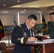 Maj. Gen. K.K. Chinn, US Army South commanding general, signs CAA accords
