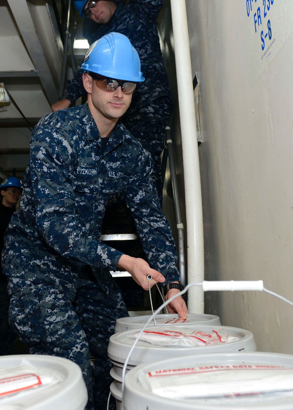 Nimitz Sailor hauls paint buckets