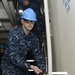 Nimitz Sailor hauls paint buckets