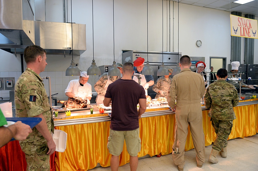 DSD and his wife serves Thanksgiving dinner to service members in Al Udeid, Qatar