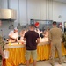 DSD and his wife serves Thanksgiving dinner to service members in Al Udeid, Qatar